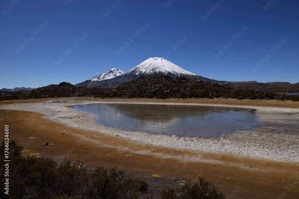 Fototapeta premium Panoramic view from the Cotacotani lagoons with the majestic Parinacota volcano, Chile