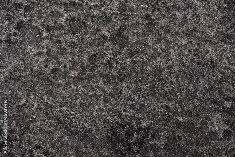 Fototapeta premium Black rock stone material with weathered prune texture