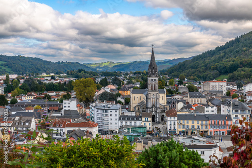 The town of Lourdes and the Sacred Heart Church in the Neo-Romanesque style, in the Hautes-Pyrénées, Occitanie, France.