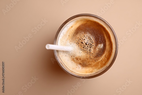Enjoying a Creamy Coffee Drink With a Straw in a Cozy Setting During the Afte...