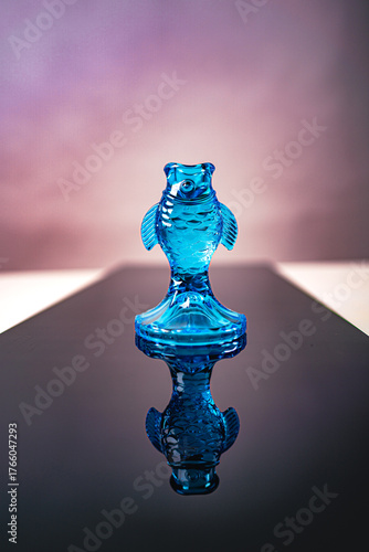 blue glass fish decoration on the path