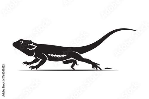 Black silhouette of a bearded dragon in motion
