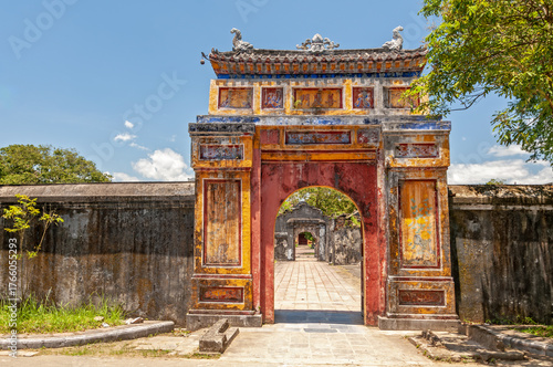 Ornate, weathered gateway in the Imperial City of Hue, Vietnam, a UNESCO World Heritage site that once served as the capital of the Nguyen Dynasty.
