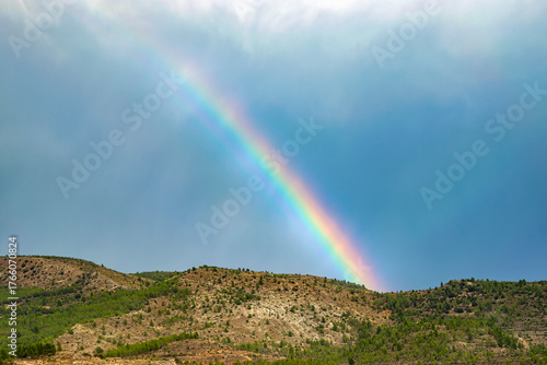Beautiful rainbow over a mountain landscape after the rain