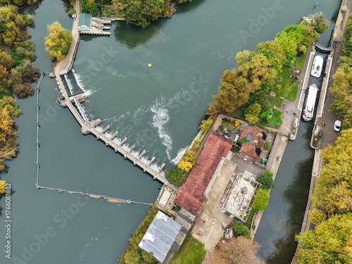 Elevated capture of the River Thames at Reading in Berkshire, UK, showing the Caversham Weir and surrounding parks