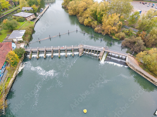 Elevated capture of the River Thames at Reading in Berkshire, UK, showing the Caversham Weir and surrounding parks