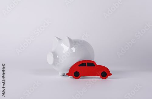 A red car placed near a whi...
