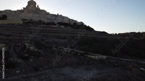 Aerial drone footage of the medieval city of Mdina in Malta a sunset