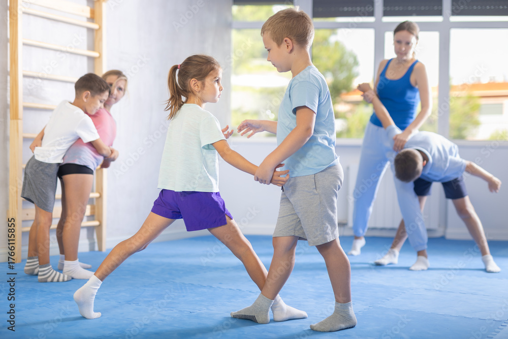 Fototapeta premium Children are focusing on their hand grip techniques to develop better control and power