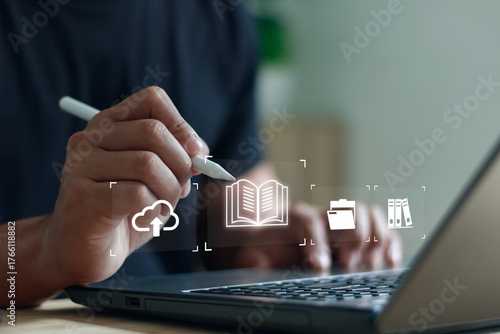 Digital learning and cloud storage concept. Person using laptop with stylus pen and online education icons, representing e-learning, document management and modern technology for remote work or study.