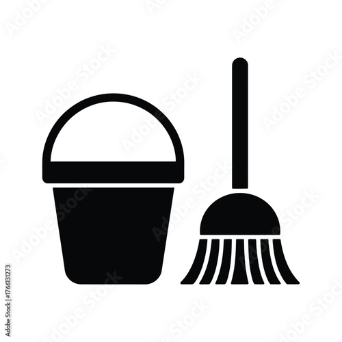 Black broom stands beside pail icon with handle on the white background