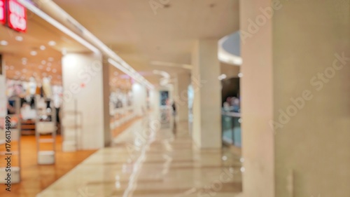 Blurry and Out of Focus Abstract Photo of a mall interior with large pillars and aesthetic light design. Perfect for background.