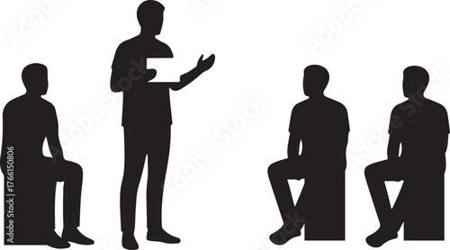 Silhouette of a speaker presenting to a seated audience or group in a business meeting, workshop, or educational session.