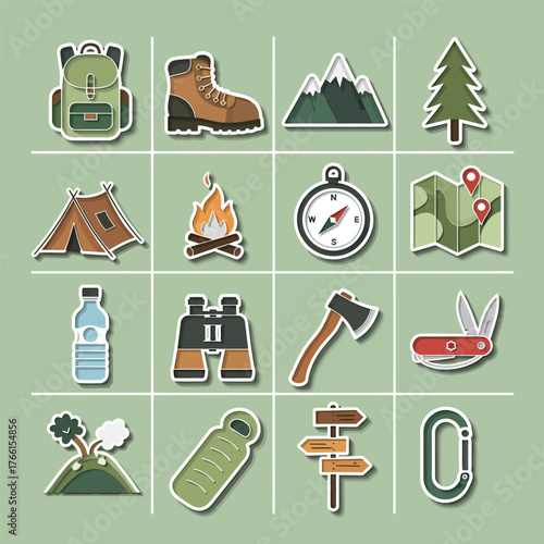 Camping equipment arranged on green surface showcasing outdoor adventure and preparedness for wilderness exploration, evoking a sense of wanderlust and readiness.
