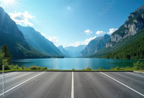 Asphalt road square and lake water with green mountain nature landscape under blue sky. Outdoor asphalt parking lot.