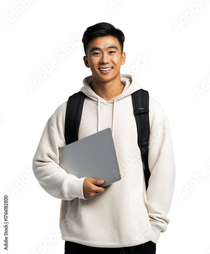 Happy and smiling Asian teenage male holding laptop and carrying backpack, isolated on white or transparent background