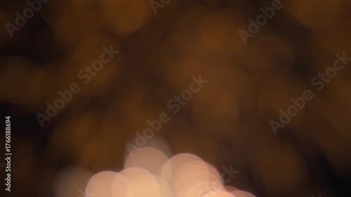 Bokeh lights of fireworks exploding on the night sky background