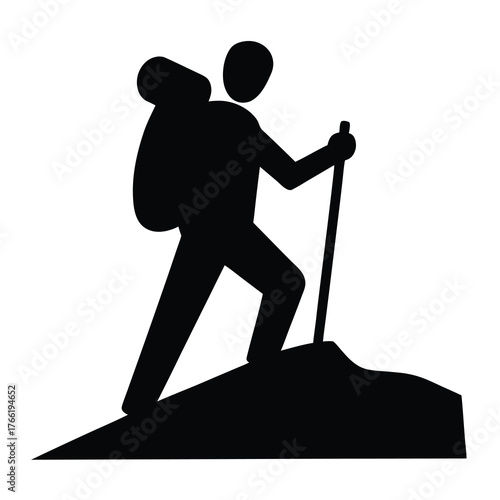 Silhouette of a hiker with a backpack and trekking pole ascending a rocky incline