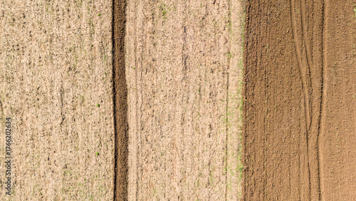 A beautiful abstract background of agricultural fields seen from a top down aerial perspective showing different colors and textures