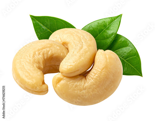 Three cashew nuts and three green leaves are isolated on a black background