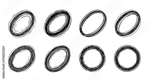Abstract black scribbled oval shapes in various orientations on white background.
