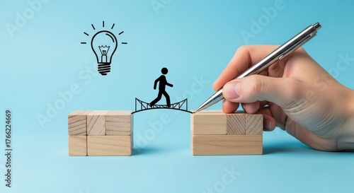 Conceptual image illustrating bridging the gap to innovation. A hand draws a pathway for a person to reach a creative idea