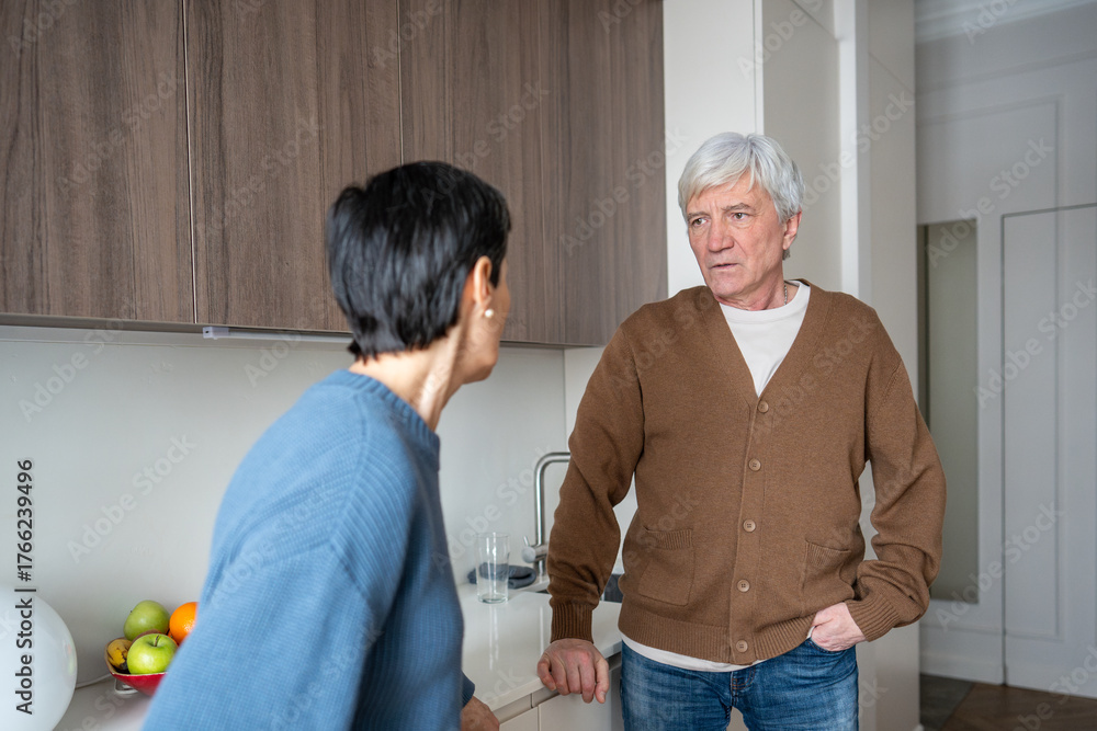 Obraz premium Furious wife scolds husband silently seethes in tense at home. Anger crisis conflict, spouse heated argument, betrayal and misunderstanding in relationship, domestic unrest, communication fail