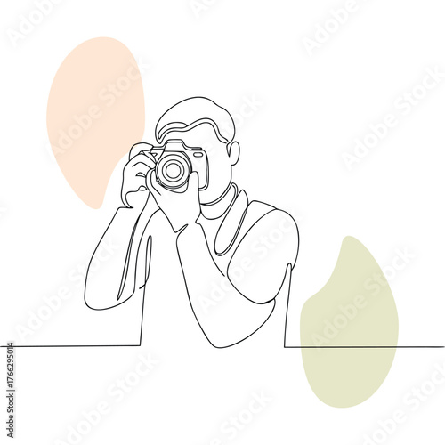 Continuous line drawing of a photographer holding a camera focusing on taking a picture with minimalist design and soft abstract shapes in the background creating artistic composition