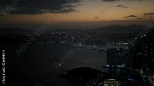 Busan cityscape at twilight with Gwangandaegyo Bridge illuminating the ocean