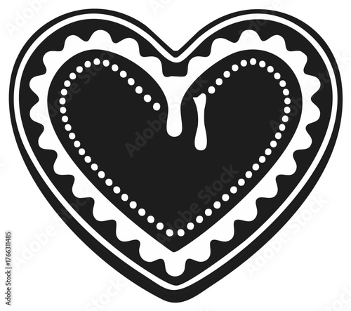 Black and white heart shaped decorated cookie with icing dripping, ornate design