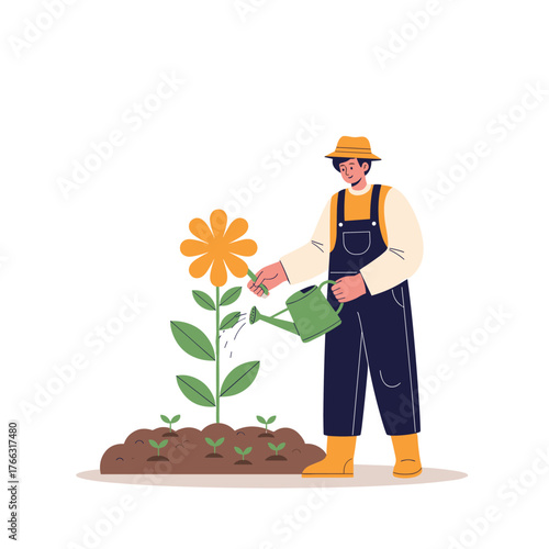 A dedicated gardener in overalls watering a large blooming flower.