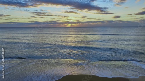 Sunrise Seascape with calm seas at Newport on the Northern Beaches of Sydney, NSW, Australia.