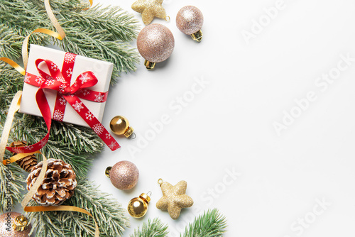 Christmas gift box with fir branches and ornaments