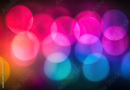 Blurred circles glow; vibrant color gradients shift & blend