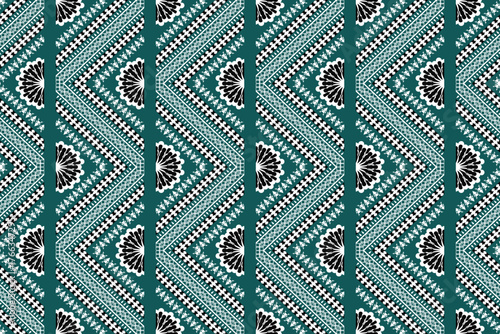 Elegant ethnic chevron pattern with floral motifs in teal, black, and white. A stylish fusion of traditional and modern design, ideal for textiles, wallpapers, fashion prints, and artistic surface dec