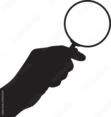 Silhouette of a Hand Holding a Magnifying Glass for Detailed Examination.
