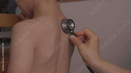 Using Stethoscope to Examine Child - back– Pediatric Healthcare 1