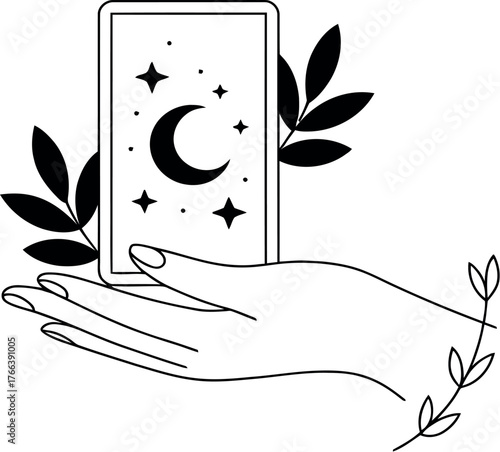 A hand holds a tarot card featuring a crescent moon and stars, with foliage.