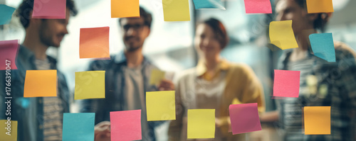 Colorful sticky note brainstorming session with colleagues collaborating on project planning and creative ideas