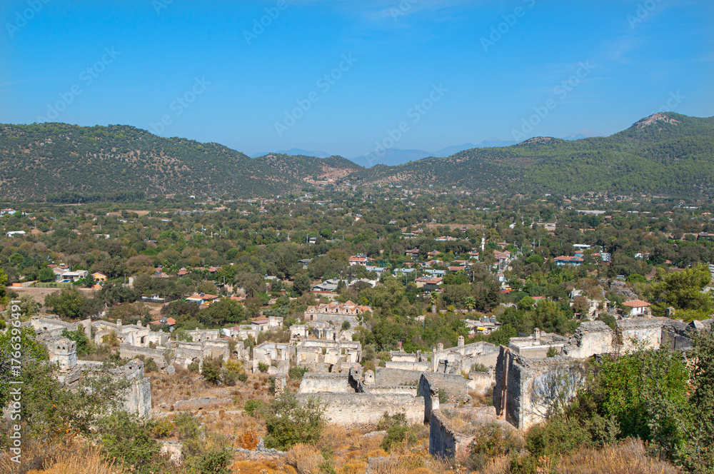 Fototapeta premium Fethiye Kayaköy stone houses and ruins. Mugla, Turkey. Kayakoy ghost village. Turkey's abandoned houses. The Ghost Town of Kayakoy. Abandoned religious ghost city.