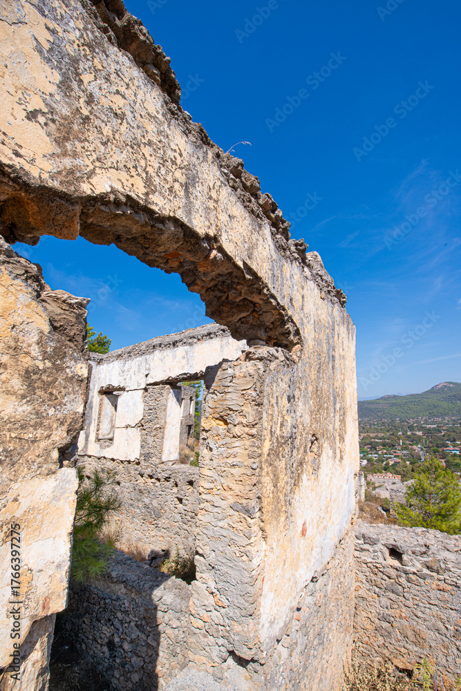 Fototapeta premium Fethiye Kayaköy stone houses and ruins. Mugla, Turkey. Kayakoy ghost village. Turkey's abandoned houses. The Ghost Town of Kayakoy. Abandoned religious ghost city.