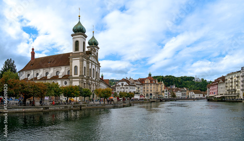 River Reuss with Jesuit Church and promenade in Lucerne, Switzerland