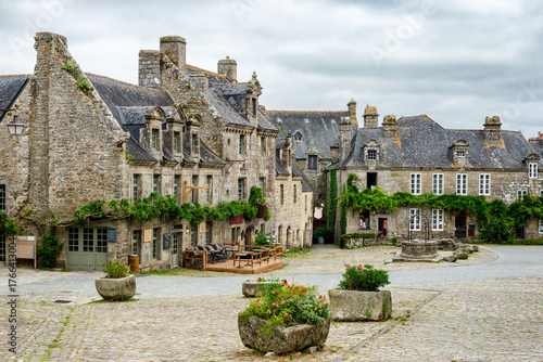 Picturesque  village square surrounded by stone houses. Photograph taken in Locronan, Brittany, France.