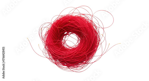 A tangled ball of bright red thread with loose strands extending outwards isolate yarn string craft textile material spool coil mess fiber hobby handmade