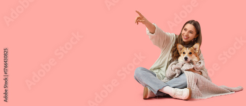 Young woman with Corgi dog ...