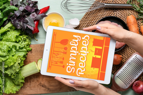 Woman holding digital recip...