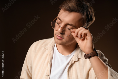 Stylish young man in eyegla...