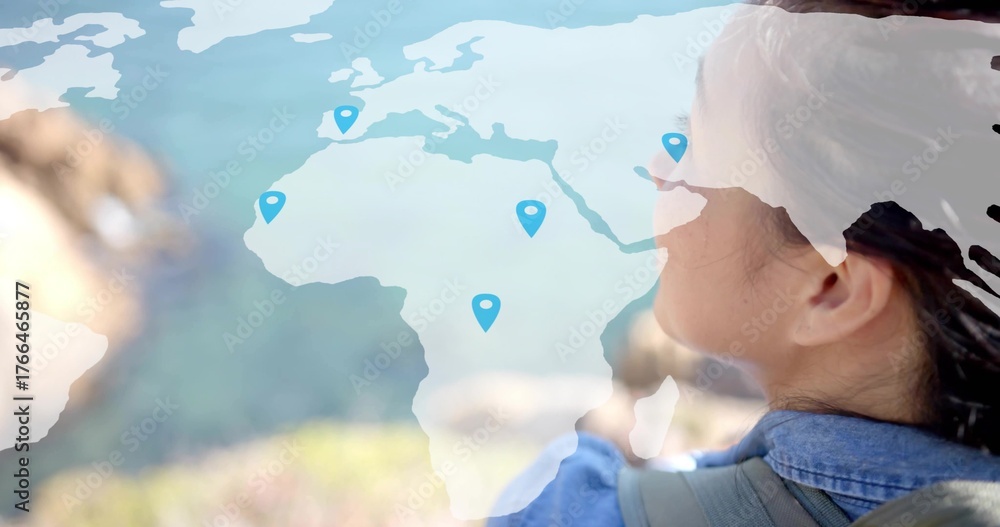 Obraz premium Gazing traveler carrying backpack at hilltop, with map overlay and blue location pins, copy space