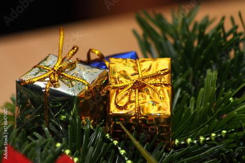 Gold and Silver Miniature Christmas Gift Ornaments on Fir Branches
