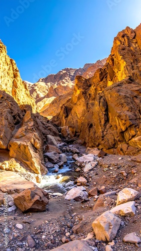 A narrow canyon scene, sunlight hitting textured orange rock formations